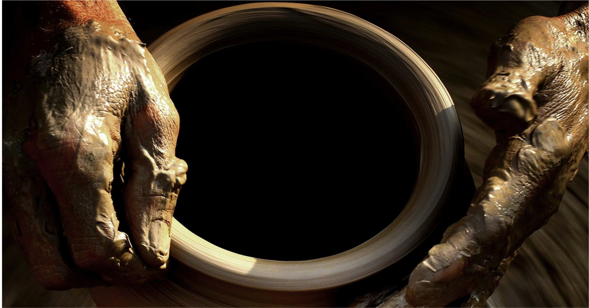 Potter's hands crafting clay